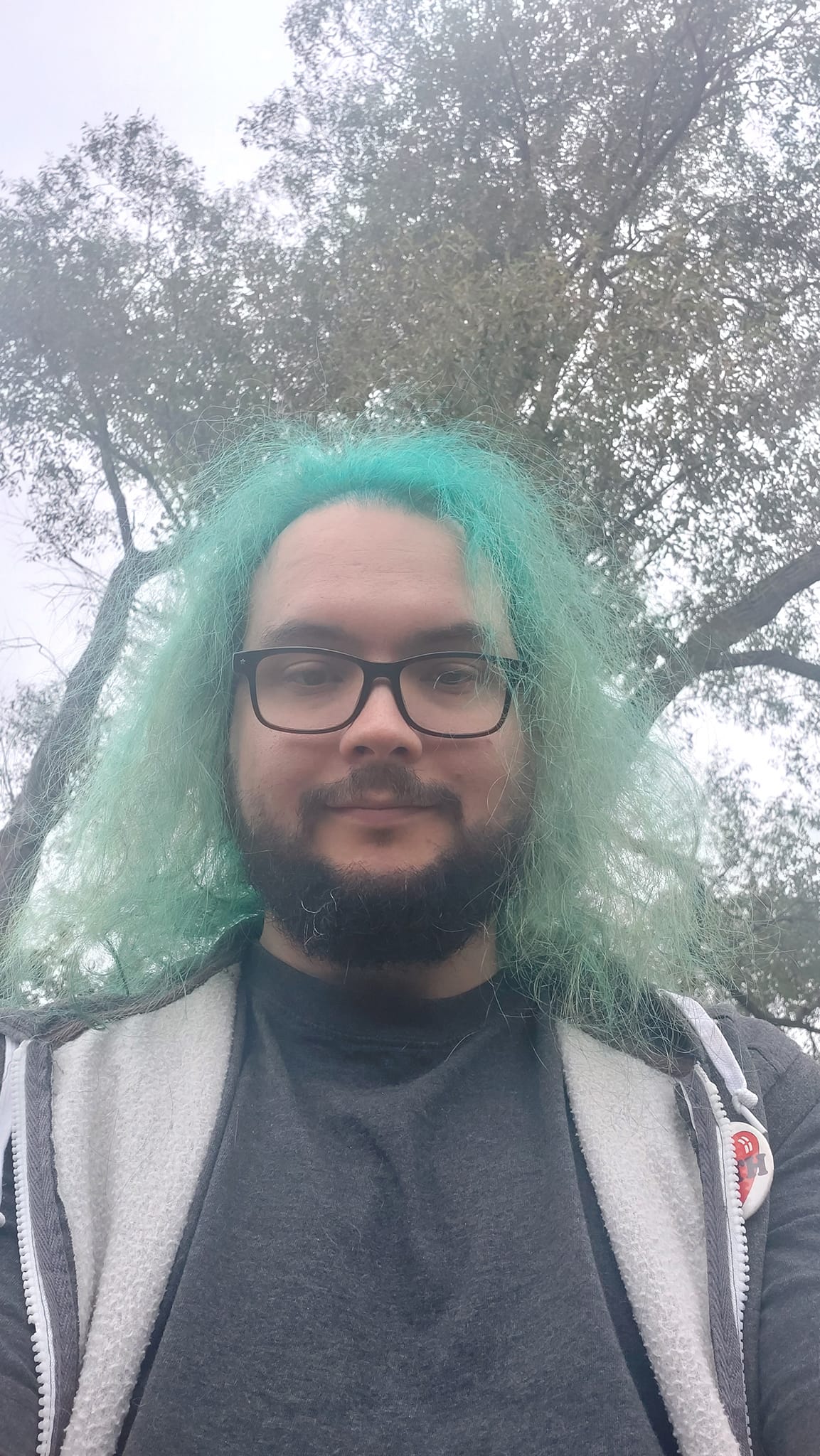 A man with green hair is visiting a freshwater marsh, photo 5